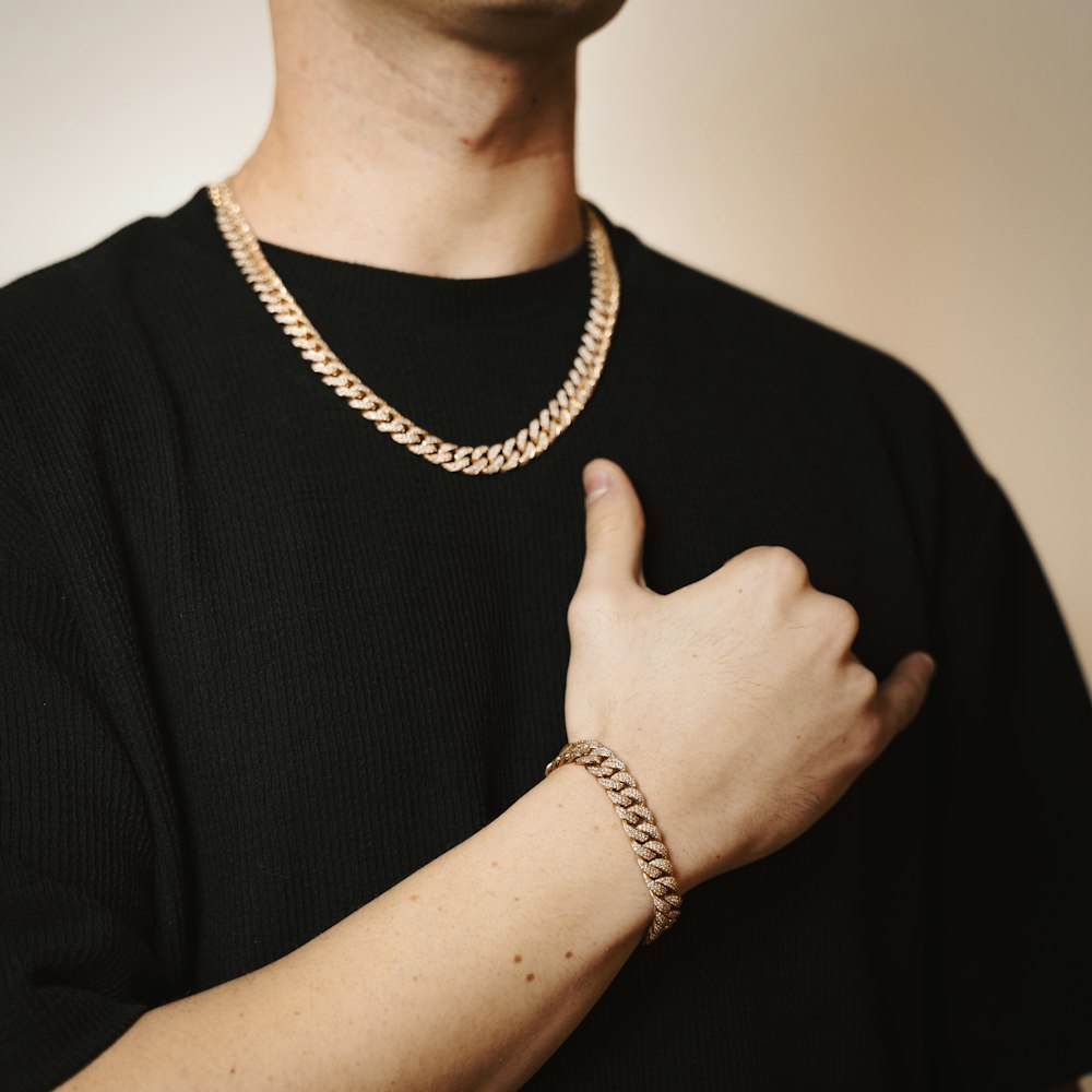 Solid gold Cuban link bracelet on a wrist