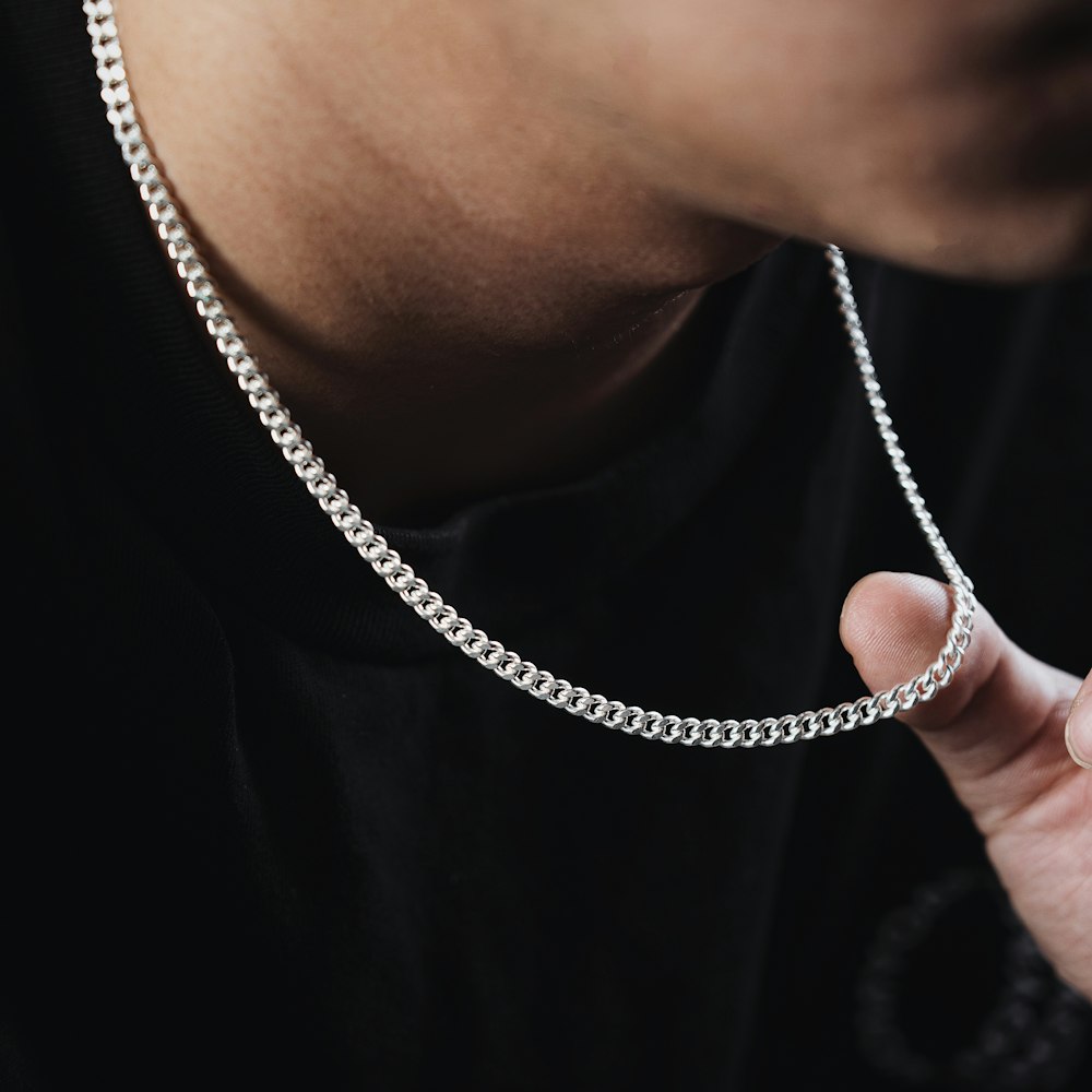 Man wearing a polished sterling silver Cuban link chain
