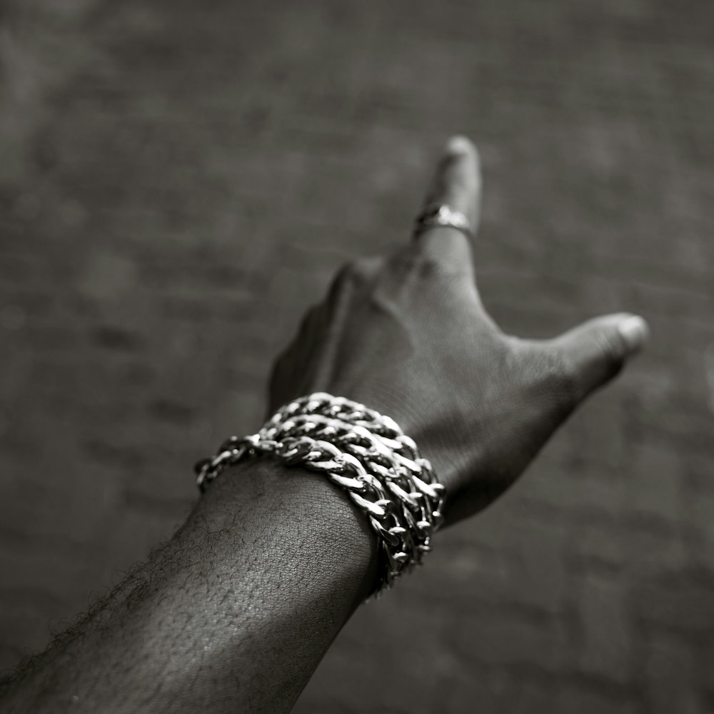 Sterling silver Cuban link bracelet worn on a wrist