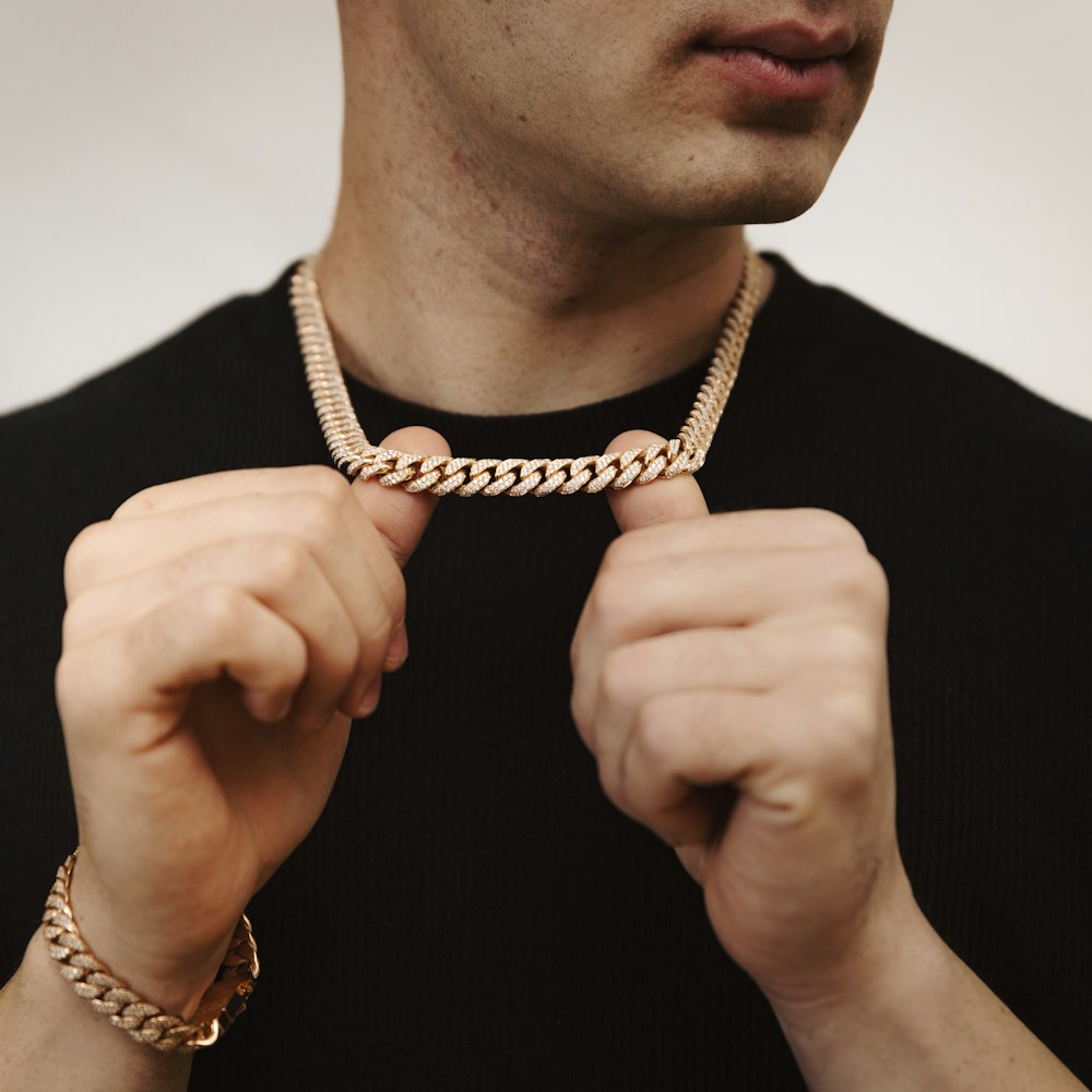 Man wearing a solid gold Miami Cuban link chain
